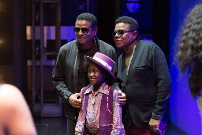 l-r Jackie Jackson, Raphael Higgins-Humes (Young Michael Jackson) & Tito Jackson on stage at the Shaftesbury Theatre - Motown the Musical - Photo credit Craig Sugden