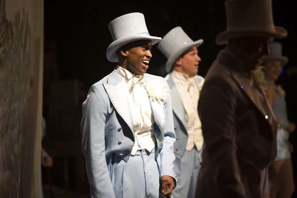 Jordan Shaw who plays Kevin and is also part of the chorus pictured from the side of the stage (c) Ellie Kurttz