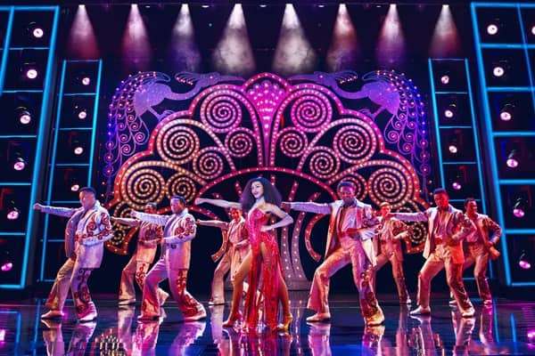 Brennyn Lark centre and company in Dreamgirls at the Savoy Theatre. Credit-Dewynters.