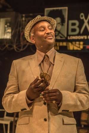 Patrice Naiambana (Paul) in Barber Shop Chronicles at the National Theatre (c) Marc Brenner.