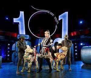 Kate Fleetwood as Cruella de Vil with Pongo and Perdi puppeteed by Yana Penrose, Emma Lucia, Danny Collins and Ben Thompson.