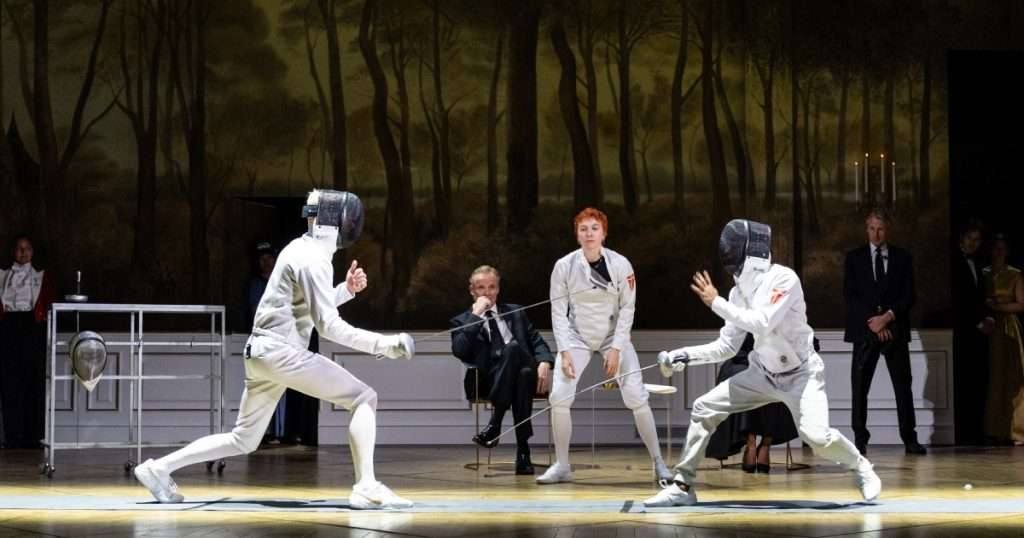 Tom Glenister (Laertes), Alistair Petrie (Claudius), Mary Higgins (Osric), Hiran Abeysekera (Hamlet) and Noel White (Bernardo) in Hamlet at the National Theatre. (c) Sam Taylor